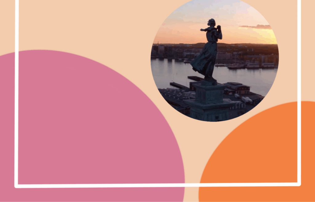 Staty framför solnedgång över Göteborg